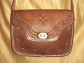 Bolso trapecio labrado click