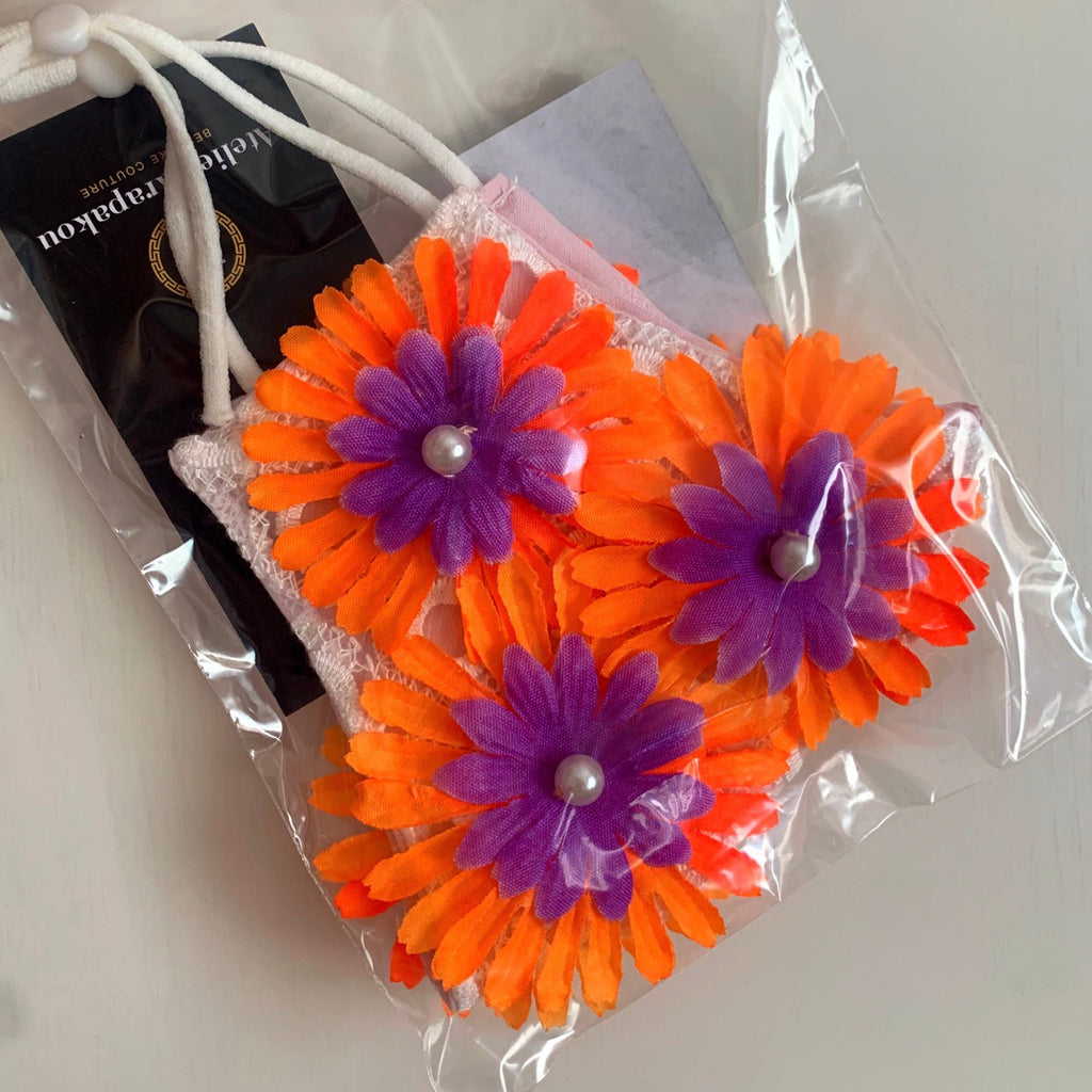 Face mask with orange and purple flowers